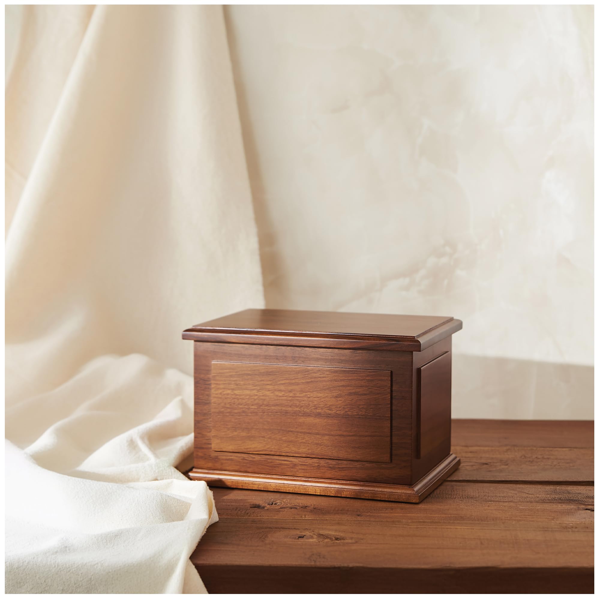 Aspen Studio walnut urn display in a calm memorial space