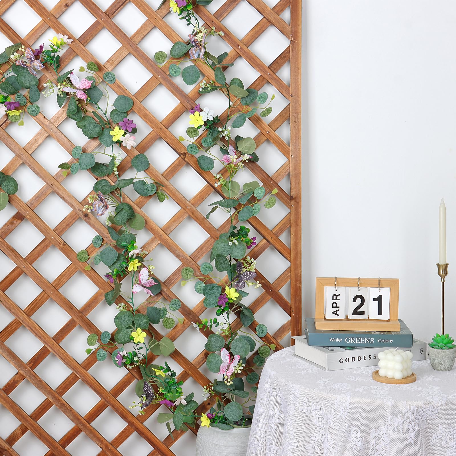 ASTNIC daisy garland with butterflies enhances mantels for festive celebrations.