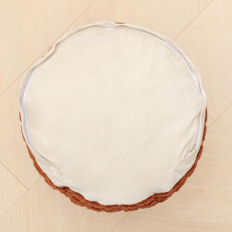 Asuprui pouf ottoman doubles as floor cushion and seating option.