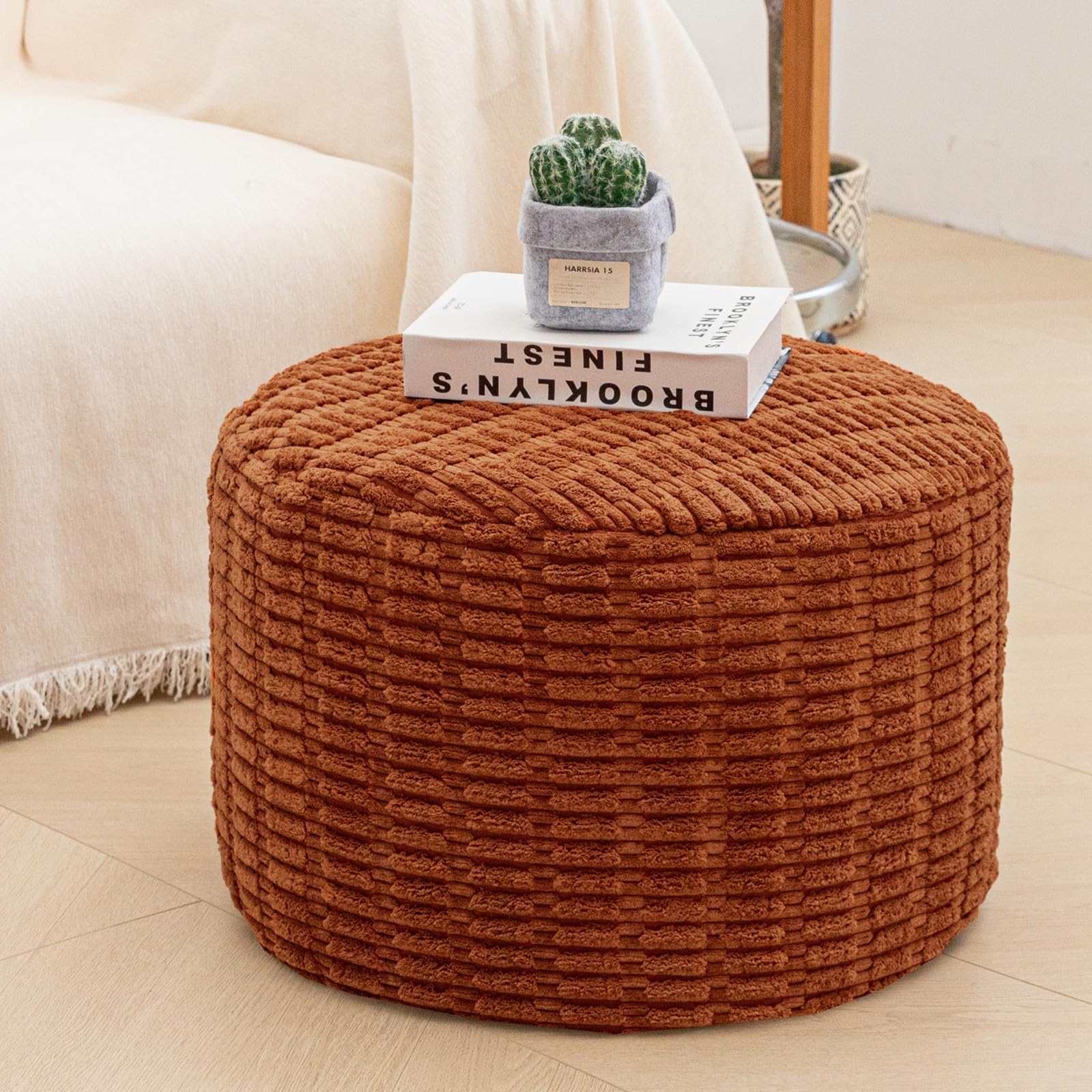 Asuprui pouf ottoman multi-use for seating, footrest, or decor.
