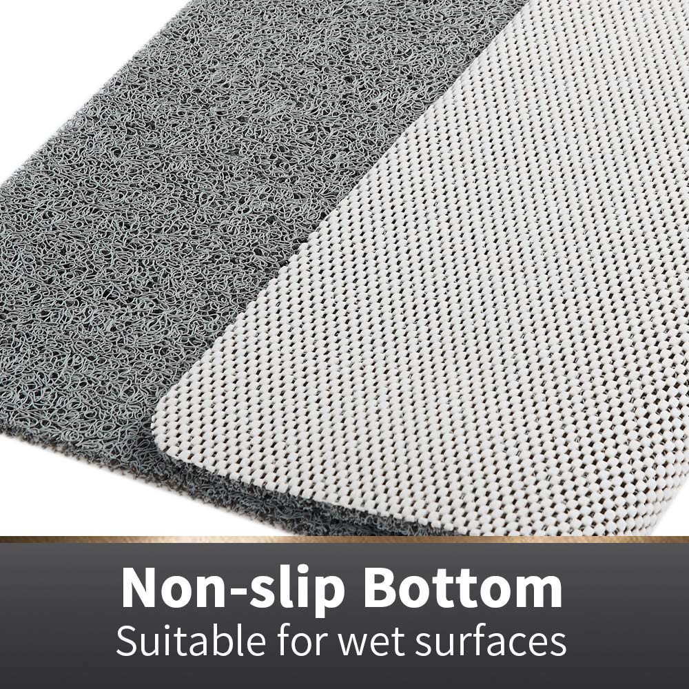 Asvin bath mat features drain holes for quick drainage and drying.