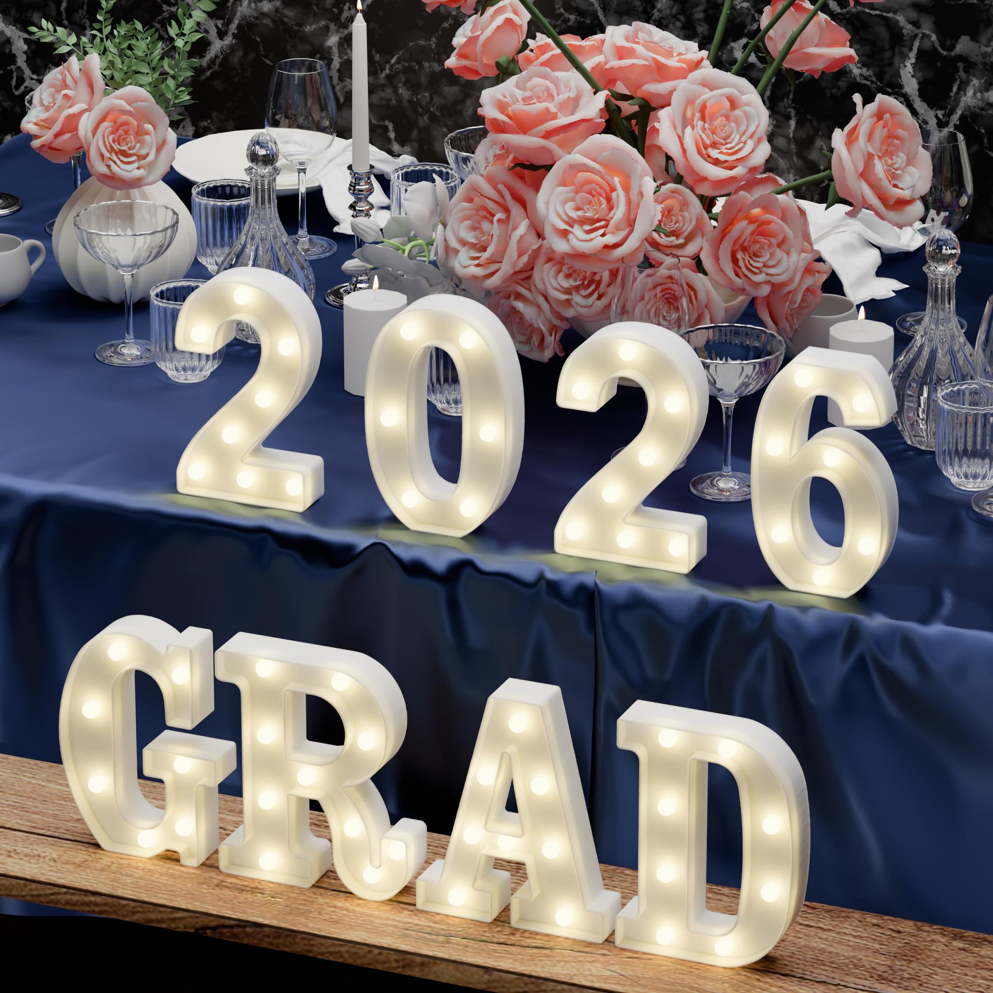 Atronor Grad 2026 LED letters brightened on a table display.