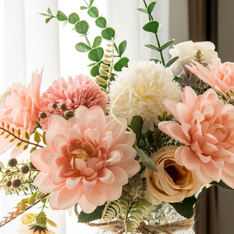 Aubcee fake flowers with vase satin-like petals and soft stems in a decorative vase.