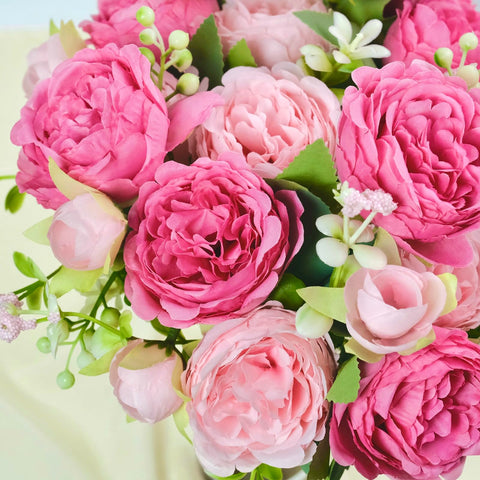 AUMVEYI wedding decor display with full blooms and greenery.