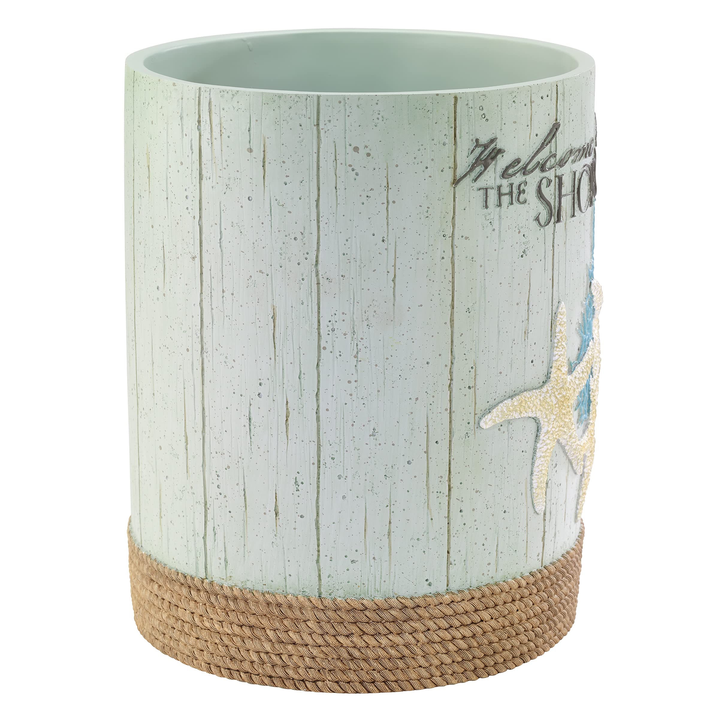 Avanti Beachcomber wastebasket placed beside sink in a coastal bathroom.