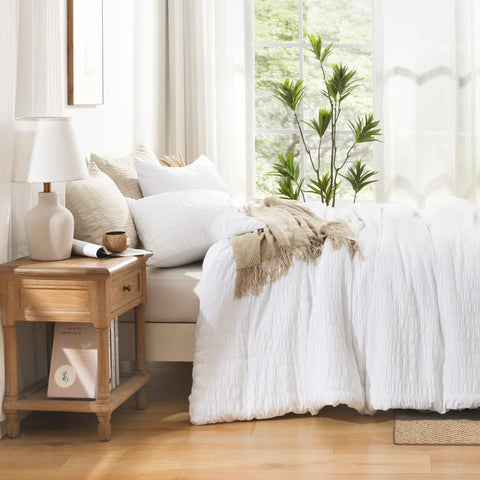 Avelom Seersucker King Comforter Set in a dim room for a serene look.