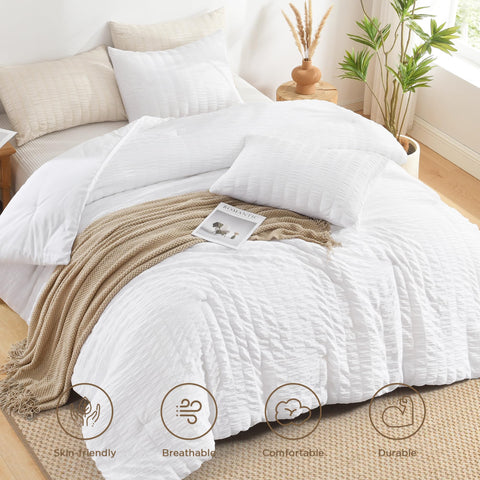 Avelom Seersucker King Comforter Set draped on bed with crisp white color.