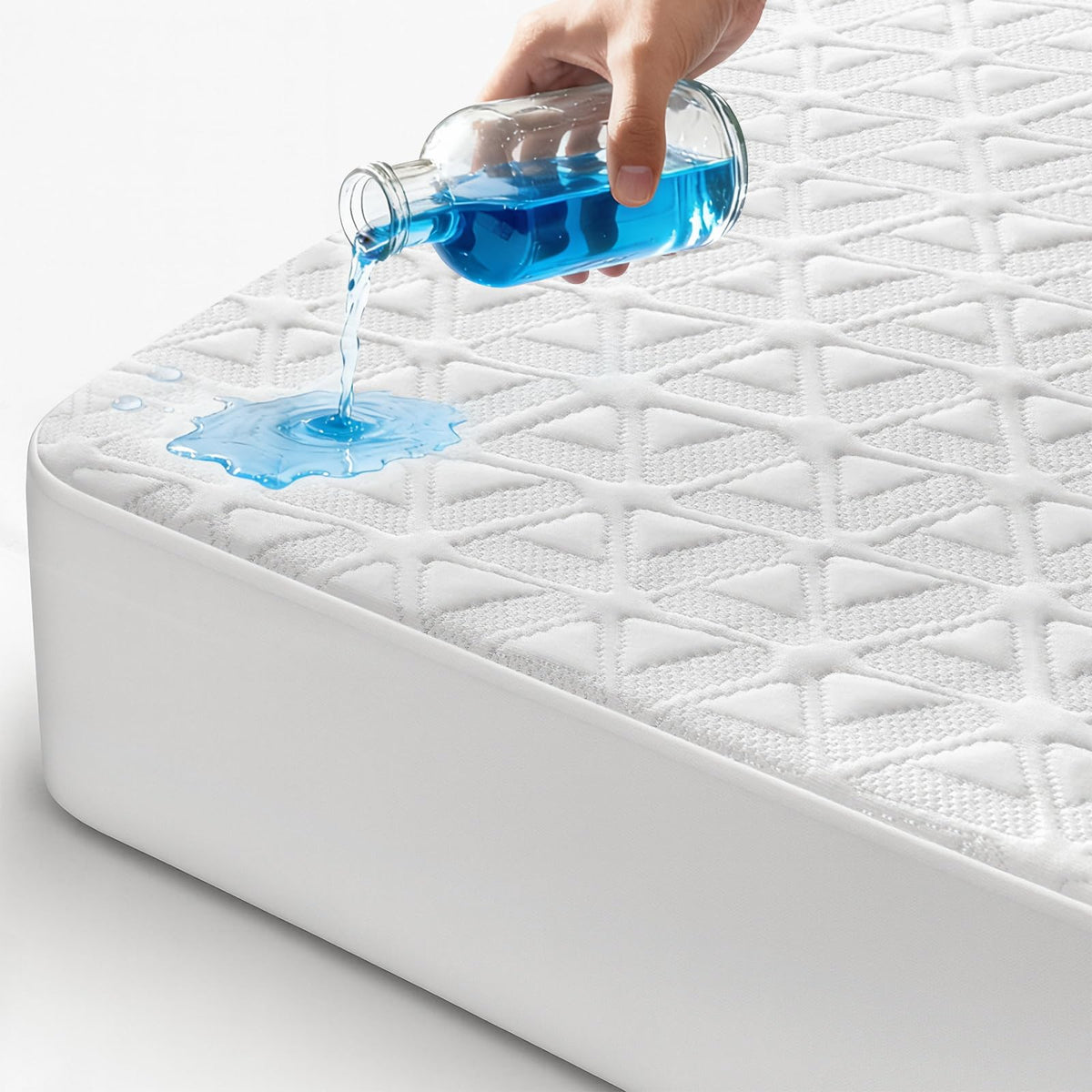 AVIKEN waterproof mattress protector on queen bed guarding against spills and stains for a clean sleep surface.