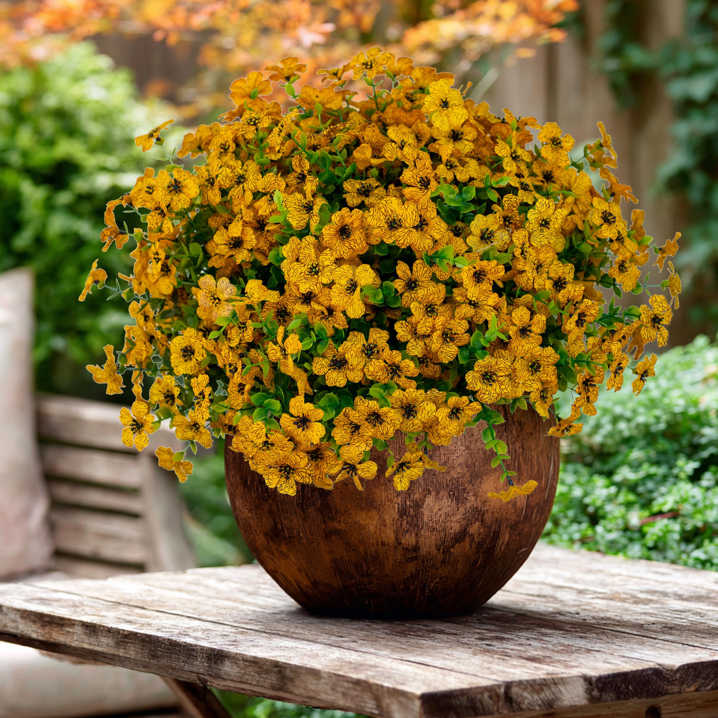 AXYLEX mums display on table, realistic texture for porch or deck ambiance.