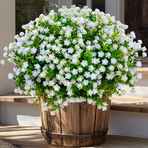 AXYLEX faux plants create inviting outdoor seating areas without maintenance.