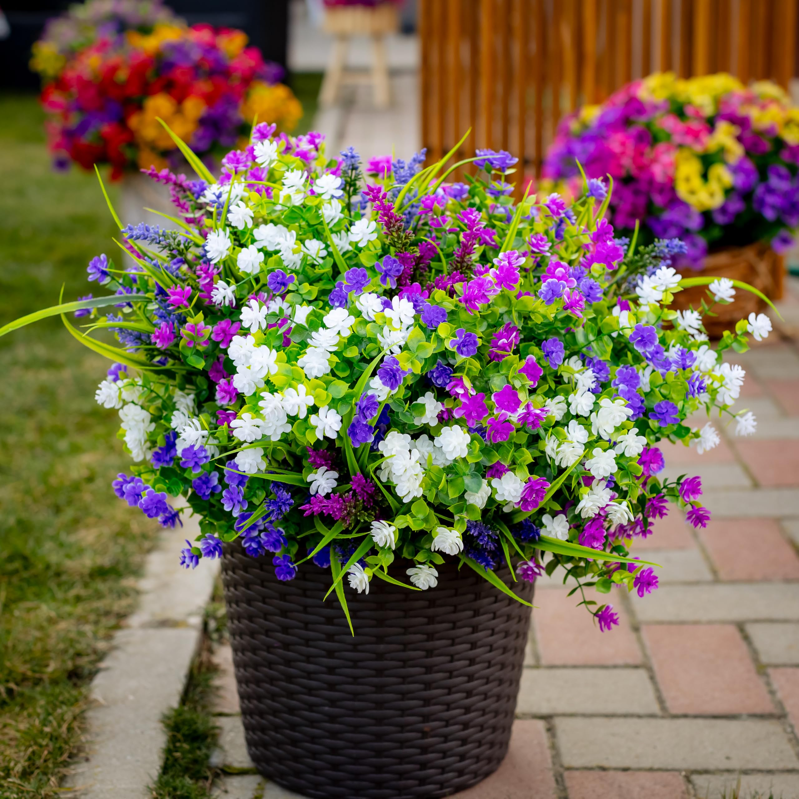 AXYLEX 14-inch tall artificial shrubs provide lush background for outdoor scenes
