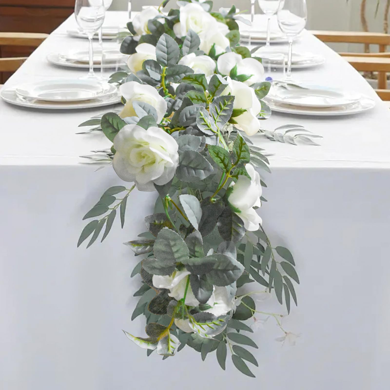 Bacucine rose garland enhances room decor with lush white roses.