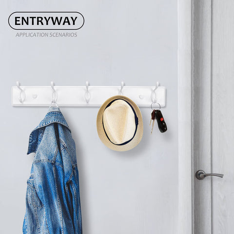 Badiano entryway setup showing wall-mounted rack beside door.