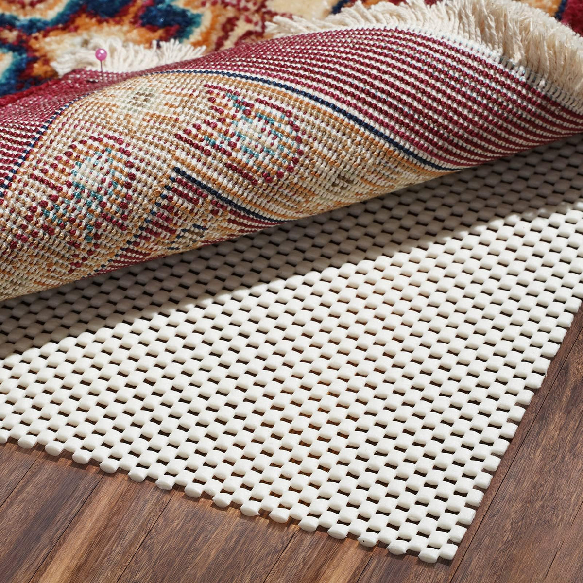 BAGAIL BASICS non-slip rug pad grips the rug on hardwood floors for stability.