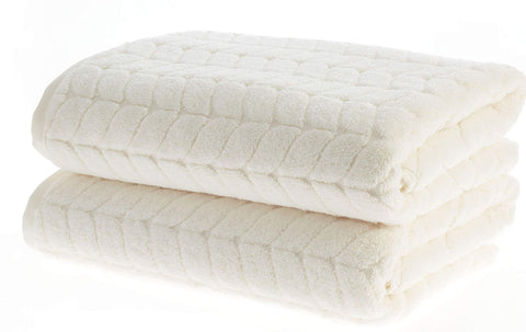 Bagno Milano 6-piece towel set in cream, neatly rolled for display.