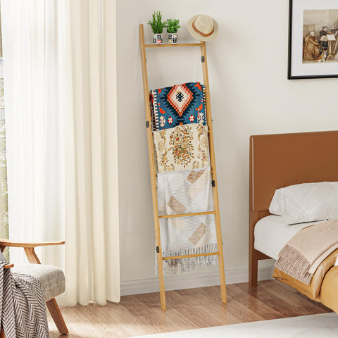 BAMBANG quilt ladder draped with blankets for display
