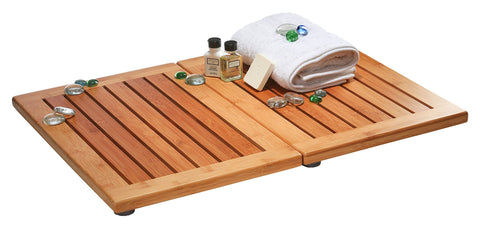 Bambüsi bamboo bath mat foldable design shown in a bright bathroom for easy storage and versatile use