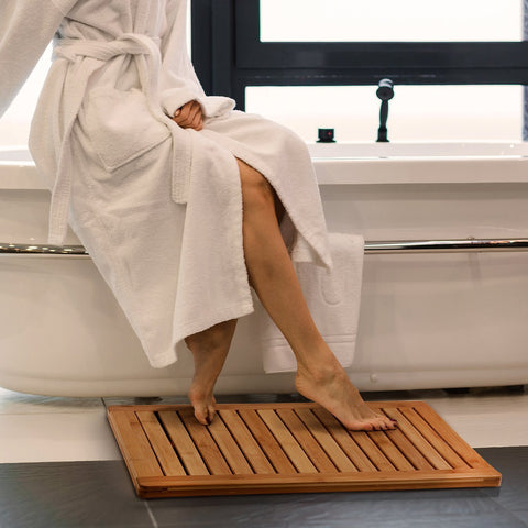 Bambüsi bamboo bath mat with non-slip feet ensuring safer footing after a shower