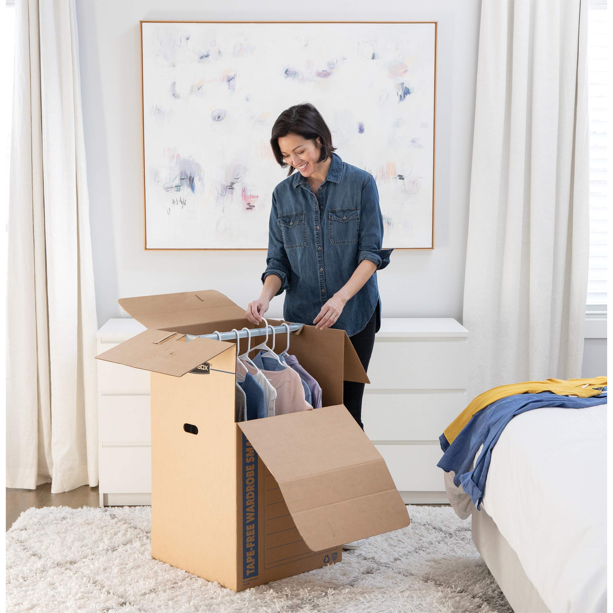 Bankers Box tall wardrobe with metal hanging bars supports apparel during move
