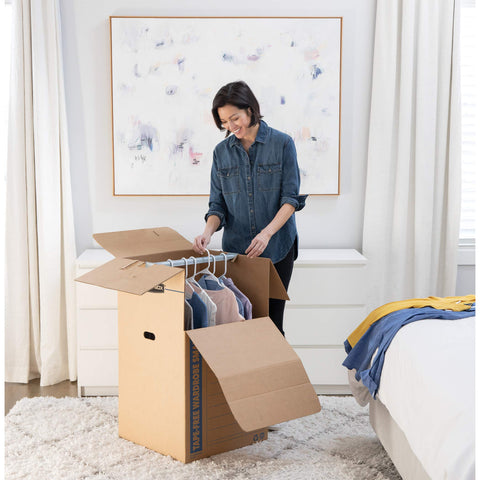 Bankers Box tall wardrobe with metal hanging bars supports apparel during move