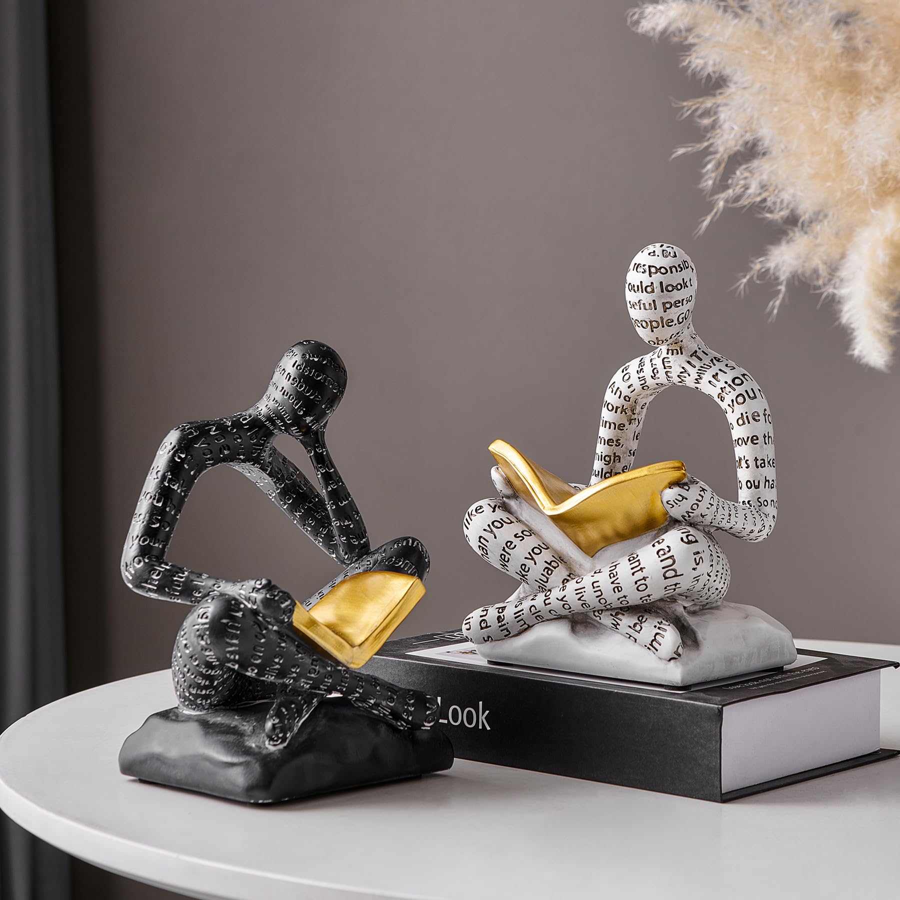 BANOMII resin bookends with paired readers serve as decorative shelf centerpiece