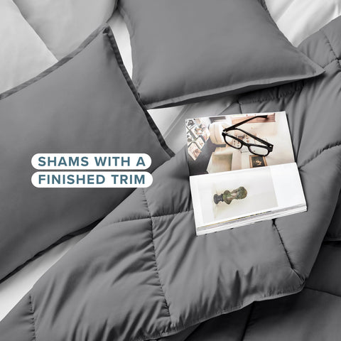 Bare Home Comforter gray draped on bed demonstrates cozy all-season warmth.