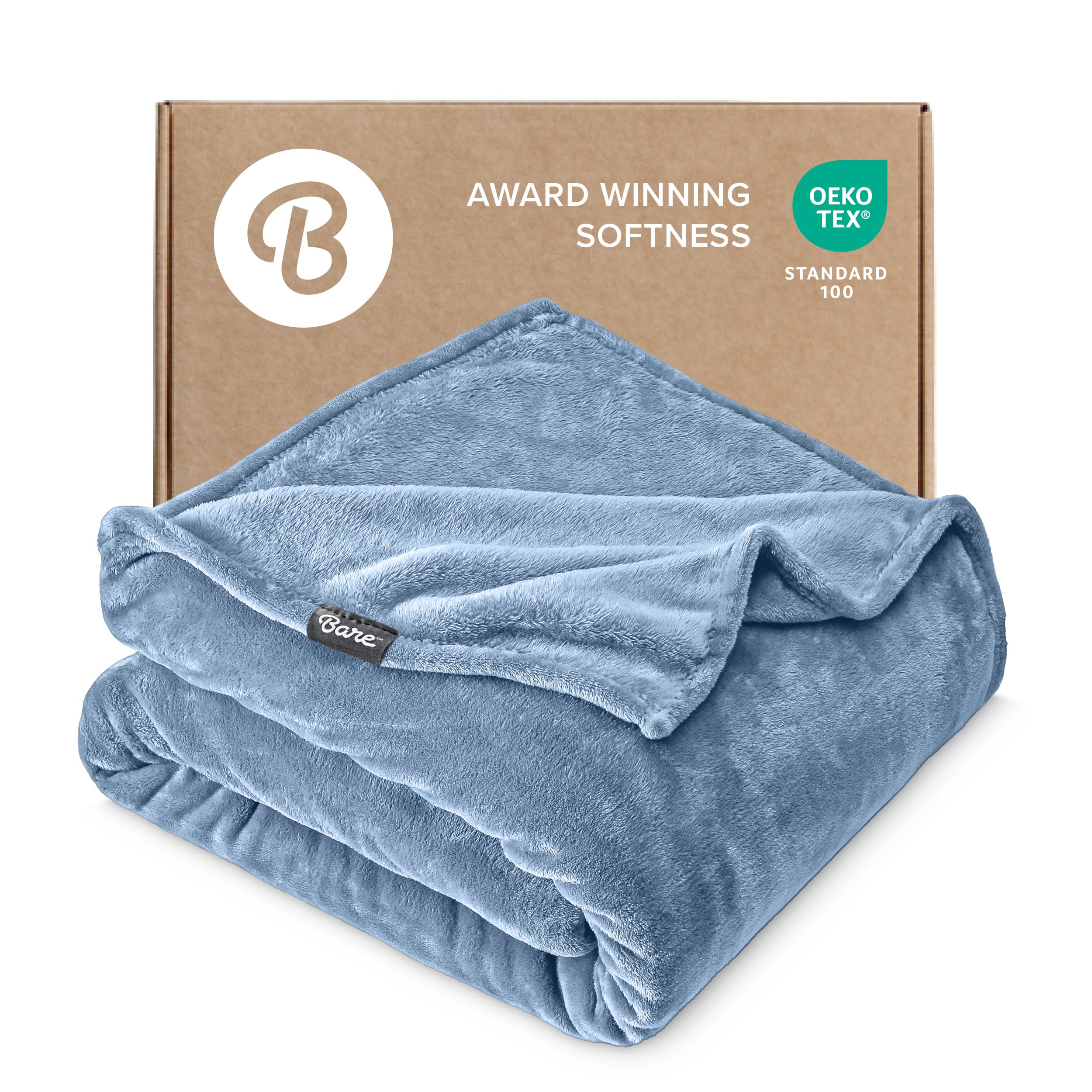 Bare Home Coronet Blue blanket laid on bed for cozy warmth