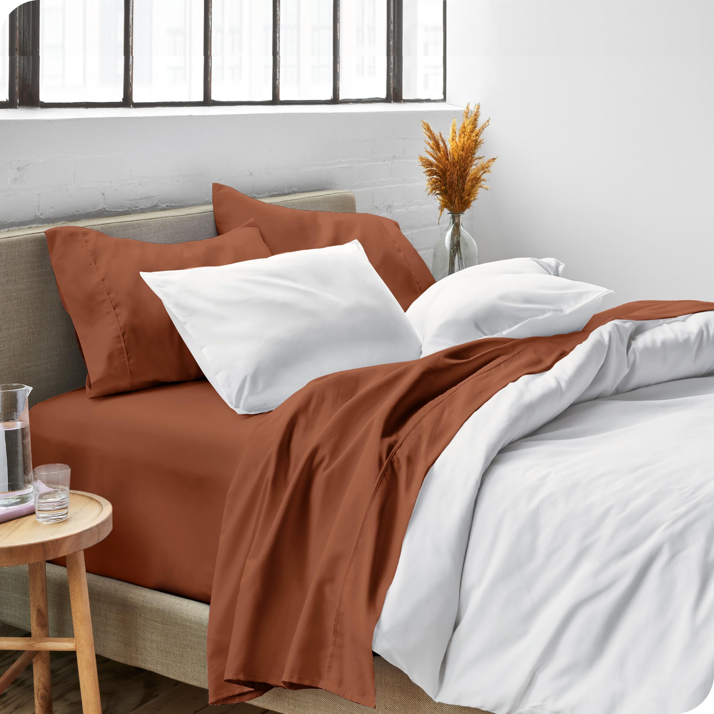 Bare Home terracotta bed scene highlights warm, inviting color and texture.