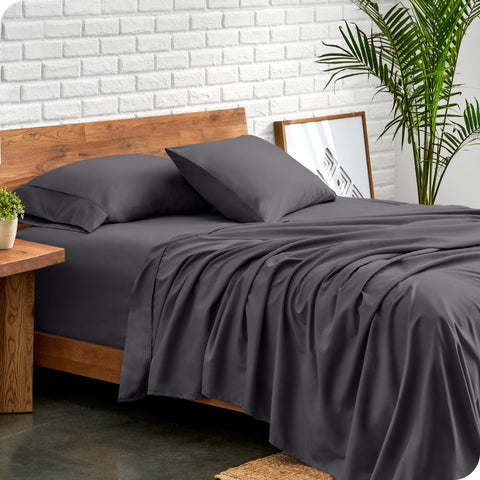Bare Home queen flat sheet on bed; lightweight, breathable year-round comfort.
