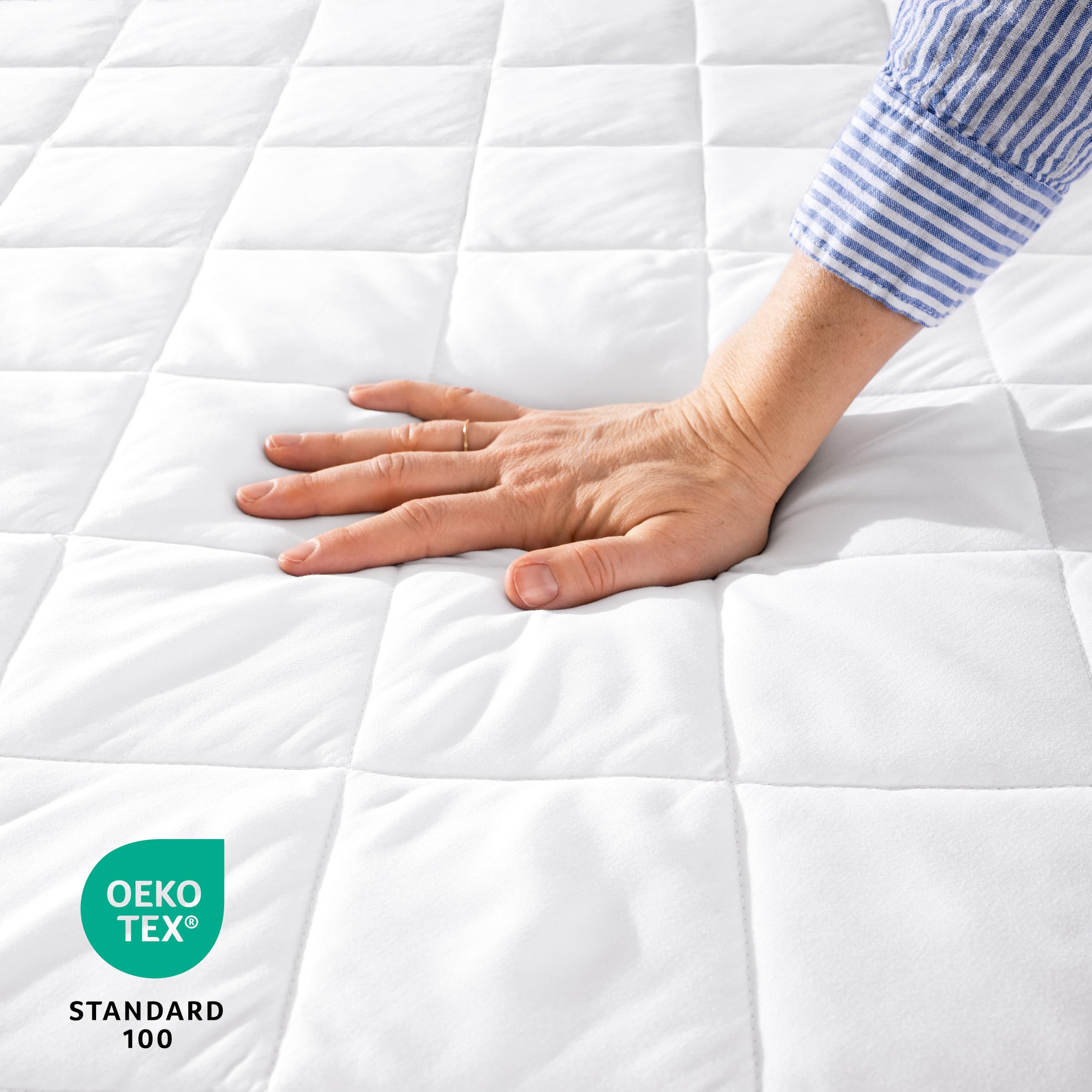 Bare Home quilted fitted mattress pad queen side view shows elastic all-around fit.