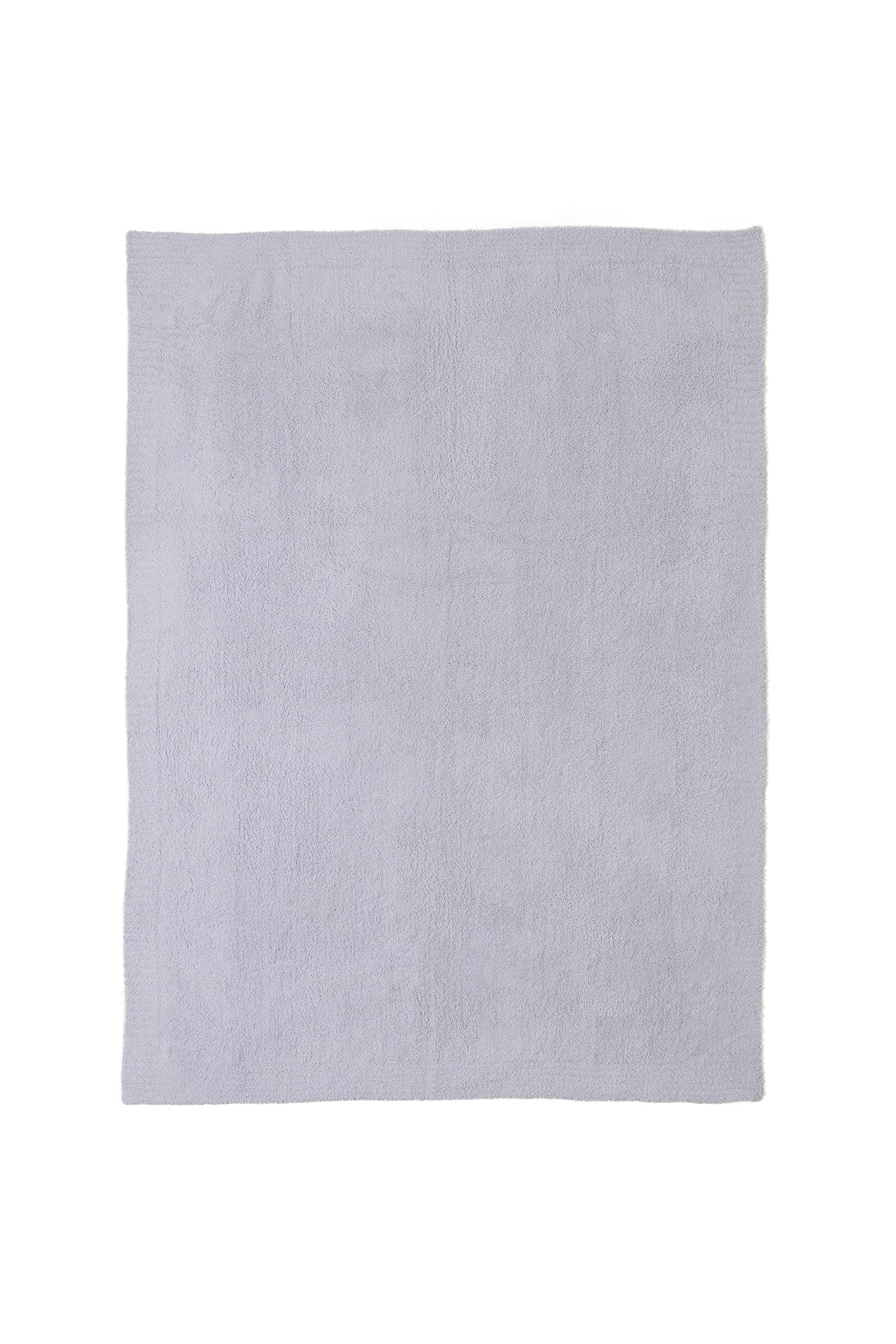 Barefoot Dreams CozyChic Throw on sofa adds luxe texture.