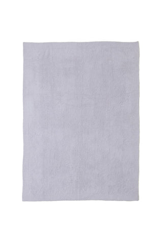 Barefoot Dreams CozyChic Throw on sofa adds luxe texture.