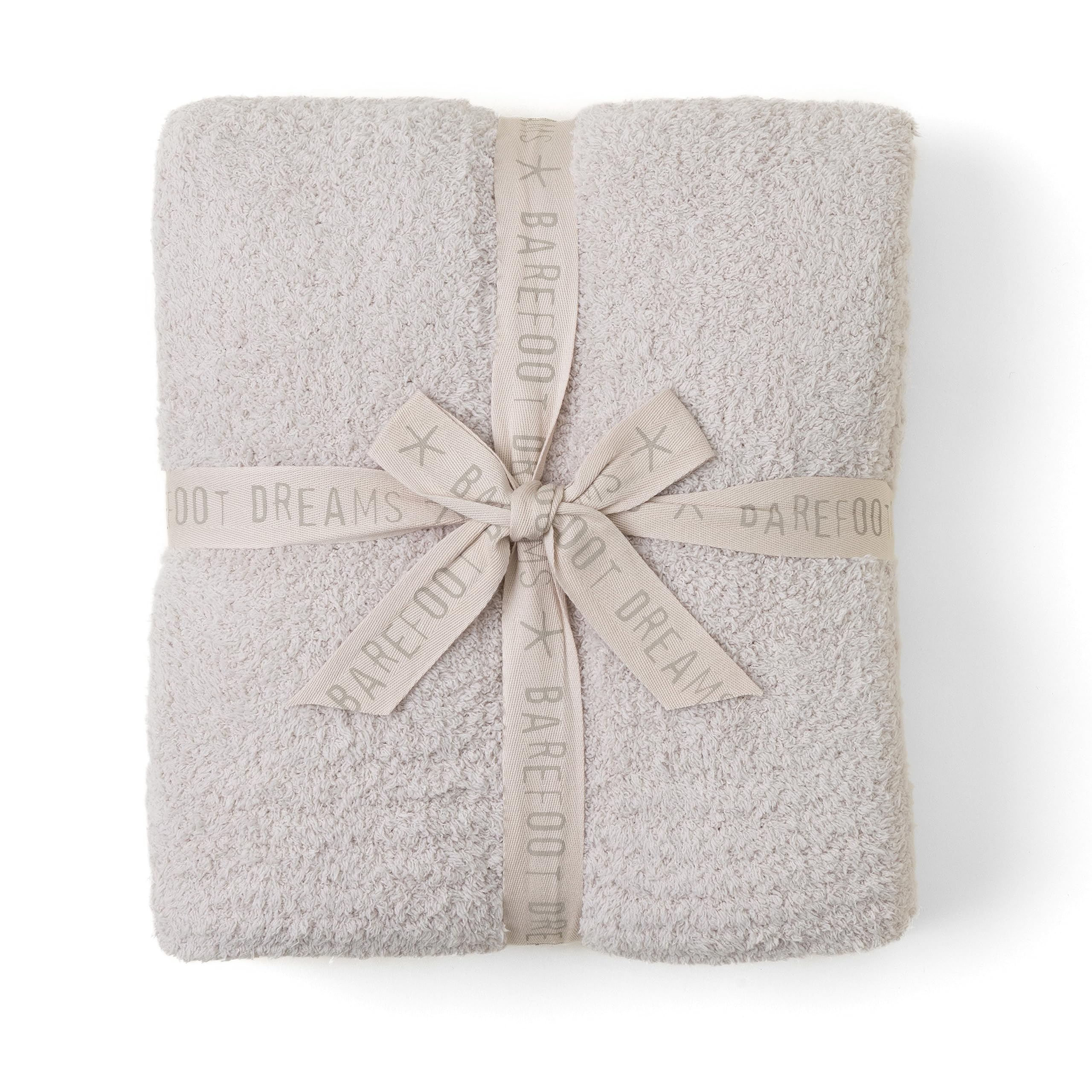 Barefoot Dreams CozyChic Throw in Stone color draped over sofa for cozy evenings