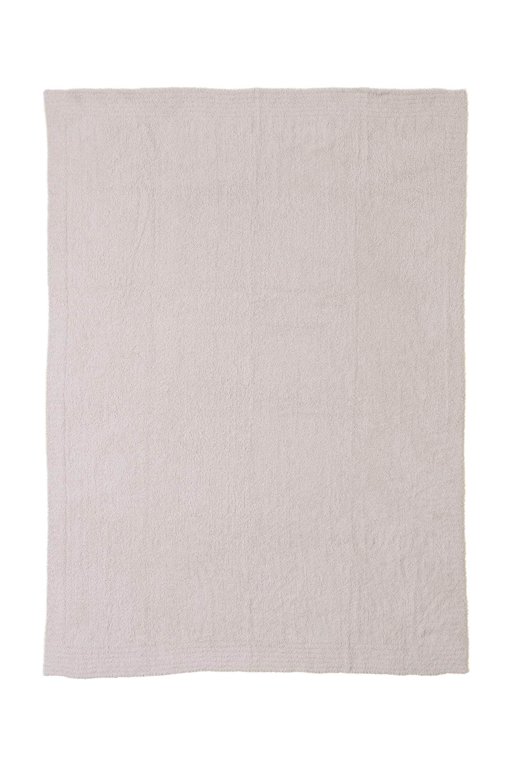 Barefoot Dreams CozyChic Throw Stone on couch for relaxed lounging