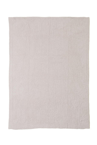 Barefoot Dreams CozyChic Throw Stone on couch for relaxed lounging