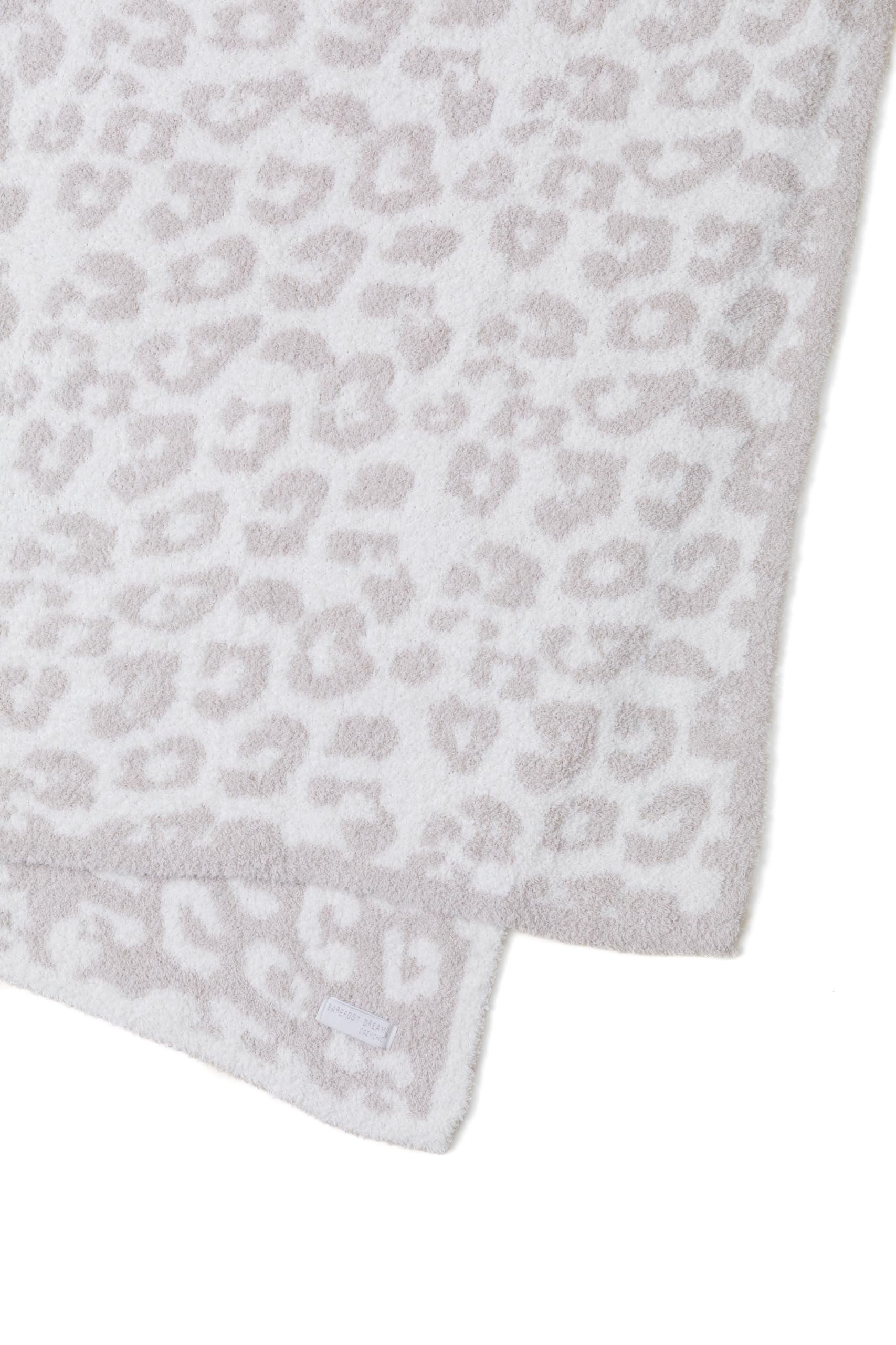 Close-up of jacquard animal print on Barefoot Dreams CozyChic throw