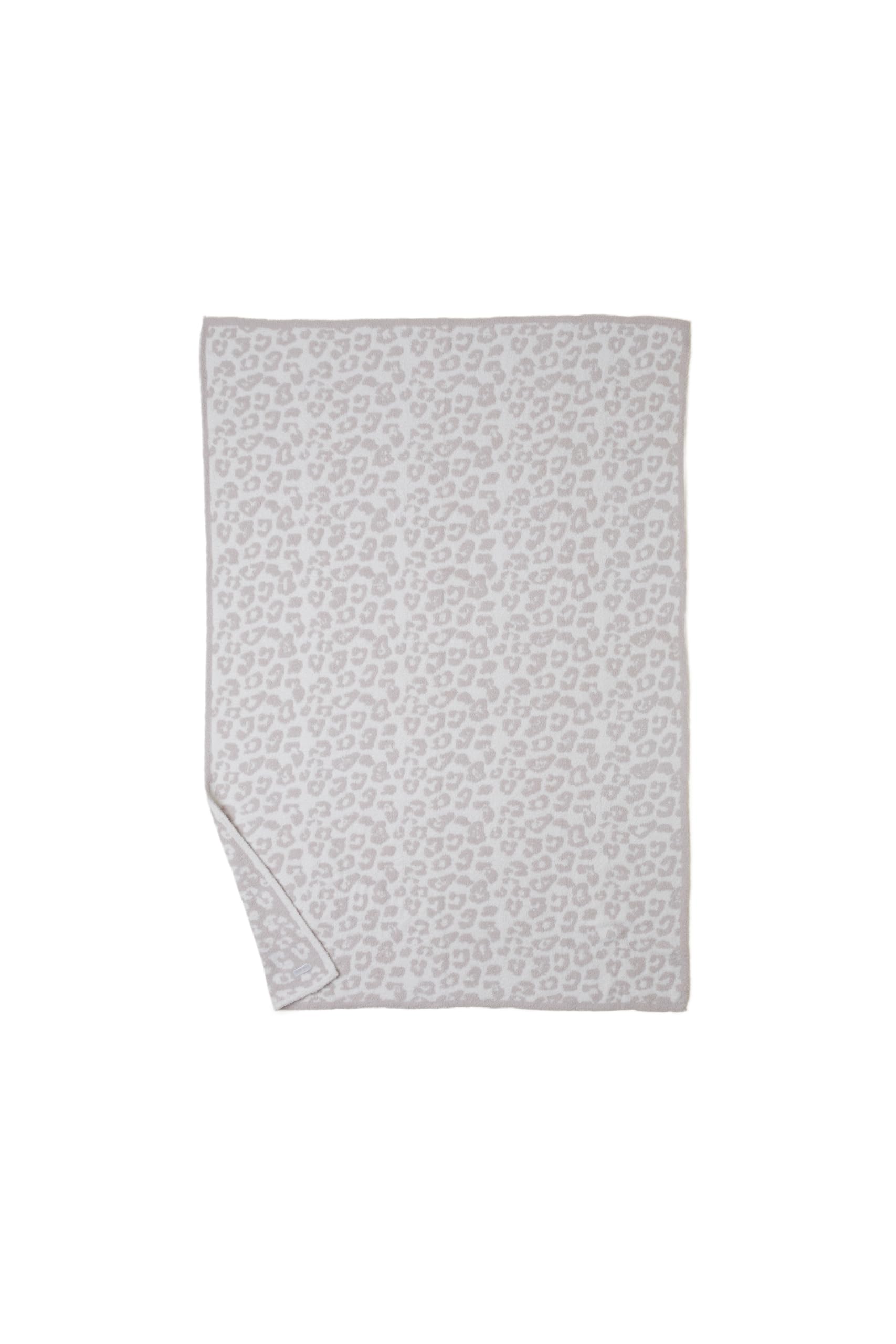 Lifestyle shot showing Barefoot Dreams throw perfect for couch lounging