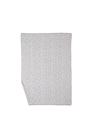 Lifestyle shot showing Barefoot Dreams throw perfect for couch lounging