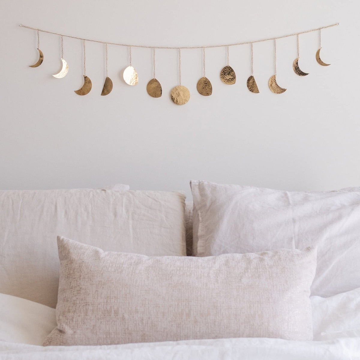 BASE ROOTS moon-phase wall decor in gold, 36-inch centerpiece that catches light beautifully.