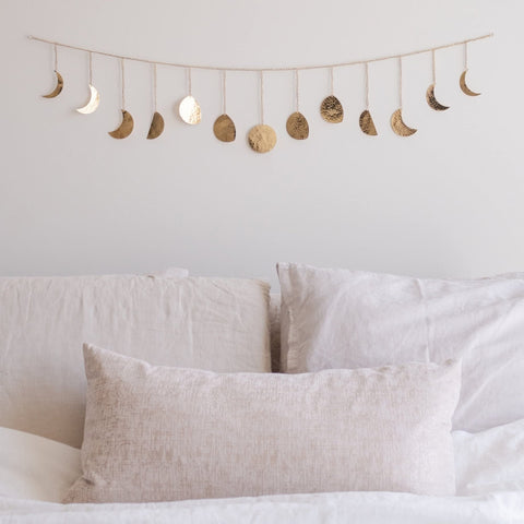 BASE ROOTS moon-phase wall decor in gold, 36-inch centerpiece that catches light beautifully.