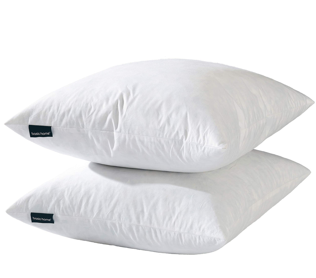 Basic Home hotel-style goose feather pillow insert on sofa delivers plush, hotel-inspired comfort.