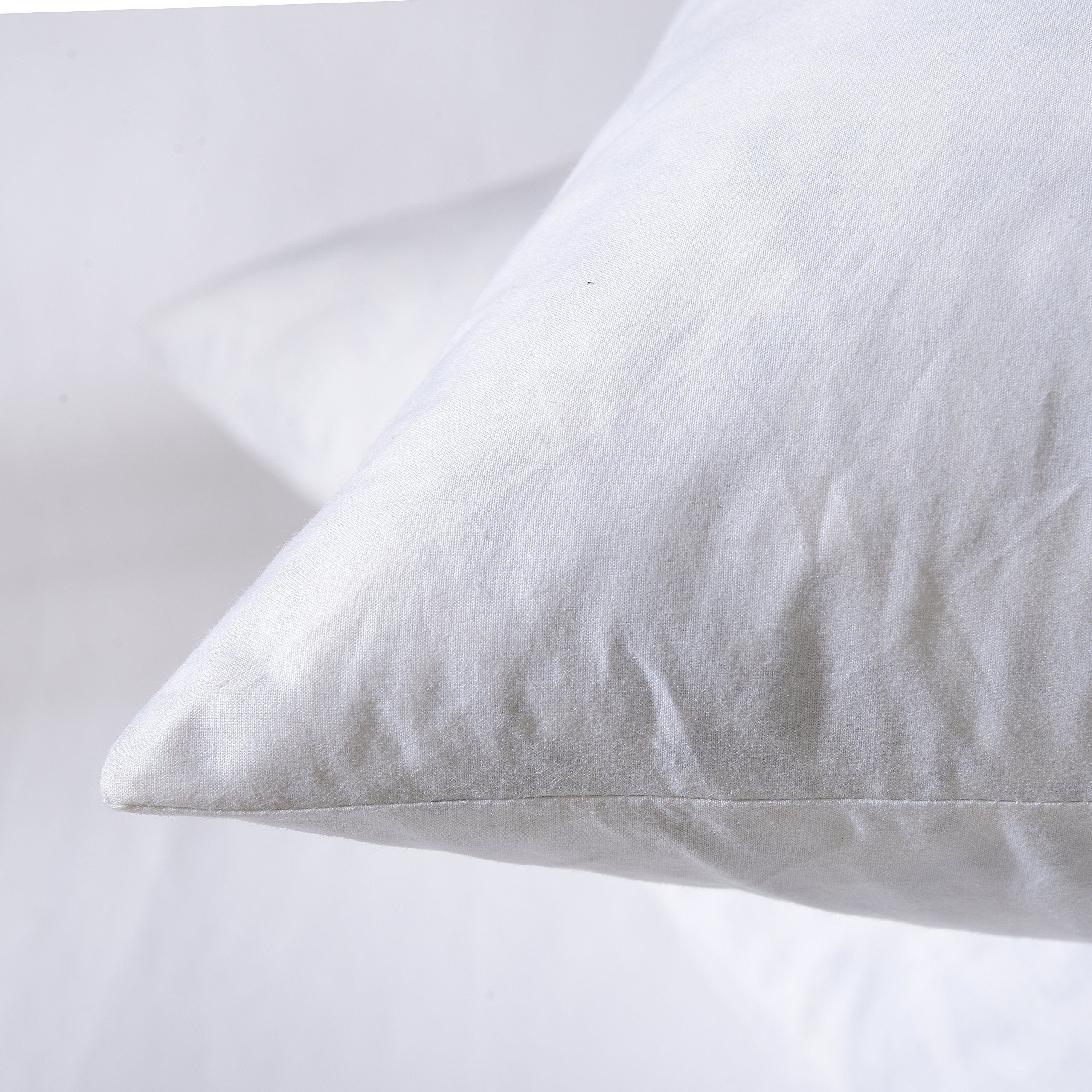Basic Home pillow insert provides cozy support for reading or relaxing.