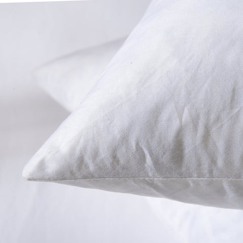 Basic Home pillow insert provides cozy support for reading or relaxing.