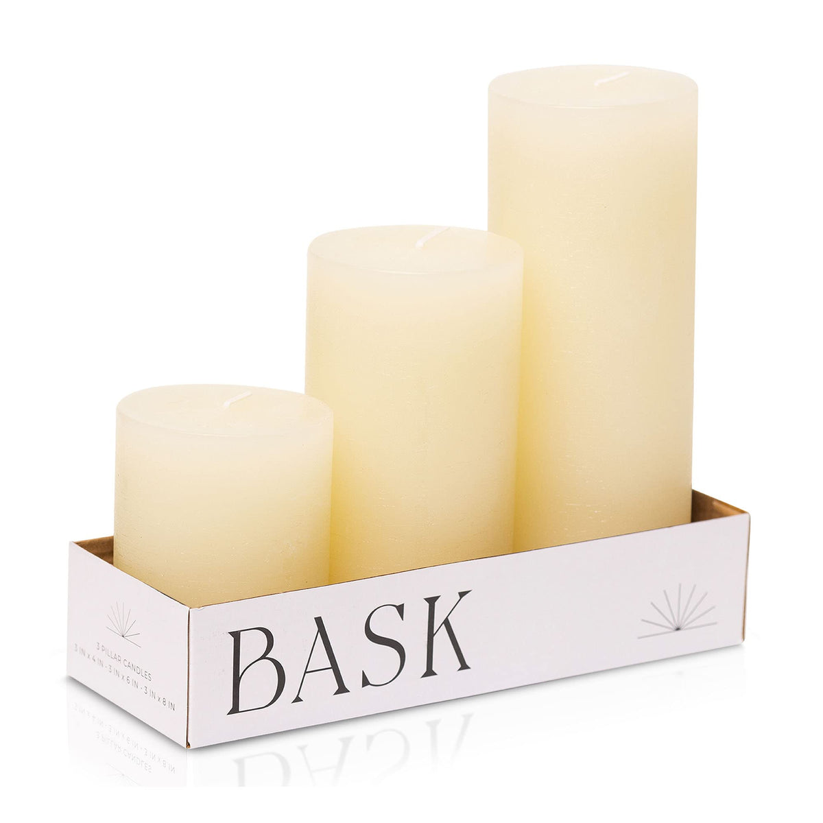 Bask mottled pillar candles in 3-inch and 4-inch ivory create a warm centerpiece