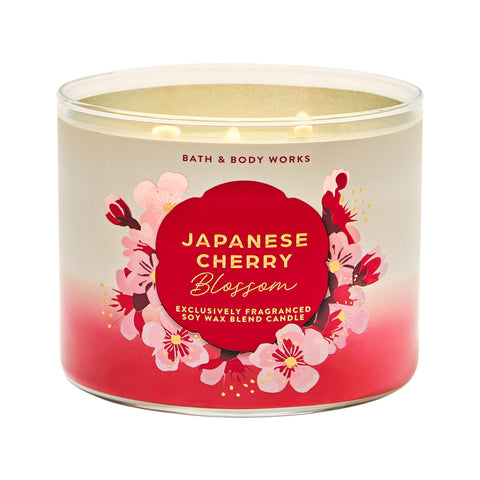 Bath & Body Works Japanese Cherry Blossom 3-Wick Candle jar releases floral fragrance into the room.