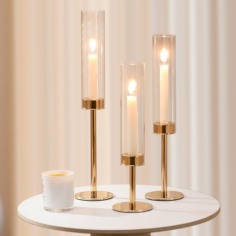 Batoslee gold hurricane candle holder outdoor dining setup in breeze