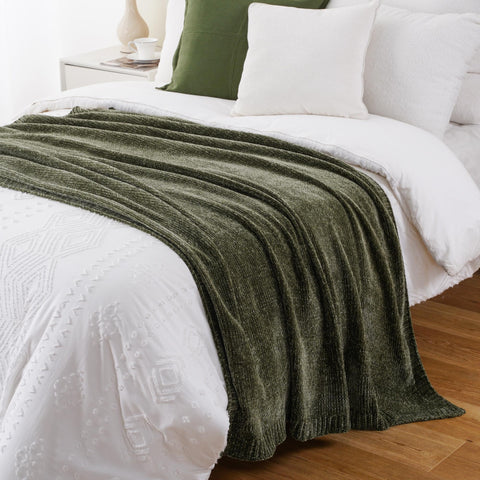 BATTILO HOME throw draped over chair adds cozy ambiance