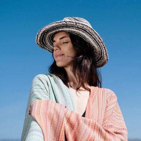 Bay Laurel oversized towel laid out for sunbathing and lounging.