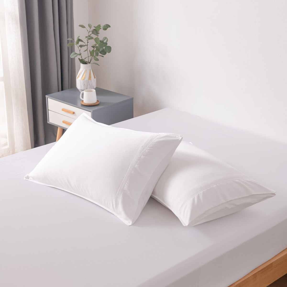 Bella Coterie bamboo pillowcase set with a soft-silky white finish for luxurious sleep.
