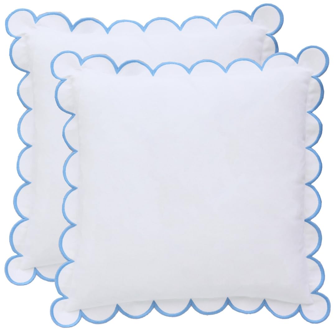 BEBE BASK Margot scalloped pillow cover in white and blue enhances living room décor.
